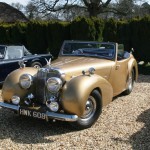 Gold Triumph Roadster. No Bergerac references, please